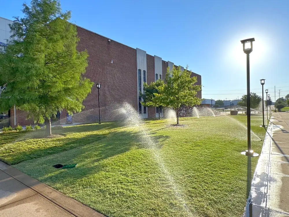 Lawn sprinklers irrigating commercial property Lawn sprinklers irrigating commercial property